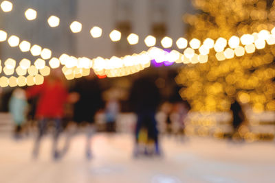 Defocused image of people walking on street