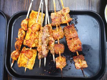 High angle view of meat on barbecue grill