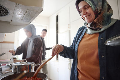 Family cooking together for eid al-fitr at home