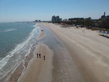 Panoramic view of beach against sky in city