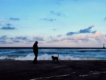 Scenic view of sea against cloudy sky