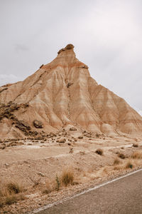 Scenic view of arid landscape against sky