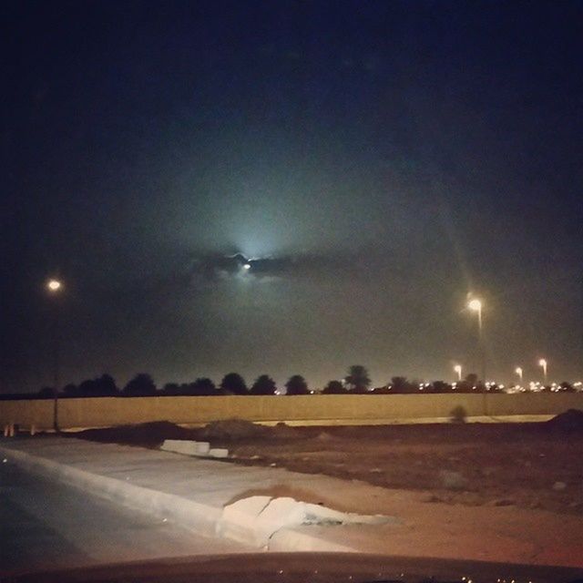 night, transportation, illuminated, road, sky, street light, road marking, street, car, mode of transport, copy space, lighting equipment, clear sky, outdoors, moon, airplane, landscape, no people, dusk, the way forward