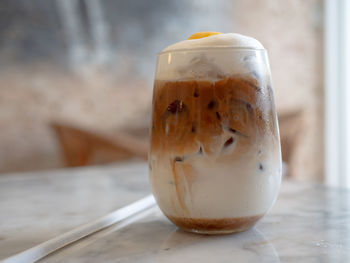 Close-up of coffee in glass on table