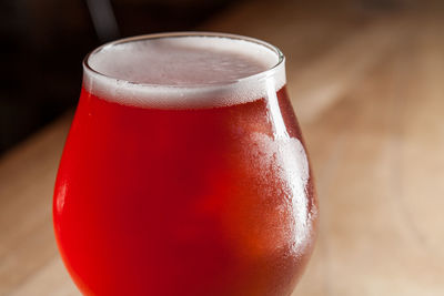 Close-up of beer glass on table