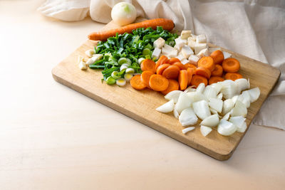 High angle view of vegetables on cutting board