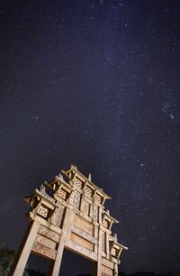 Low angle view of building against sky at night