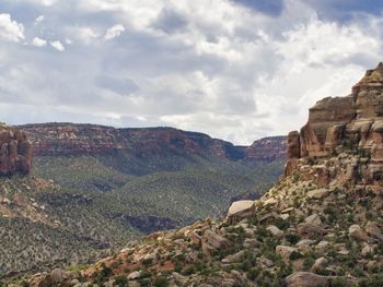 Scenic view of landscape against cloudy sky