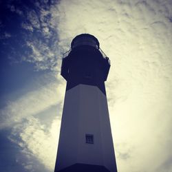 Low angle view of building against cloudy sky