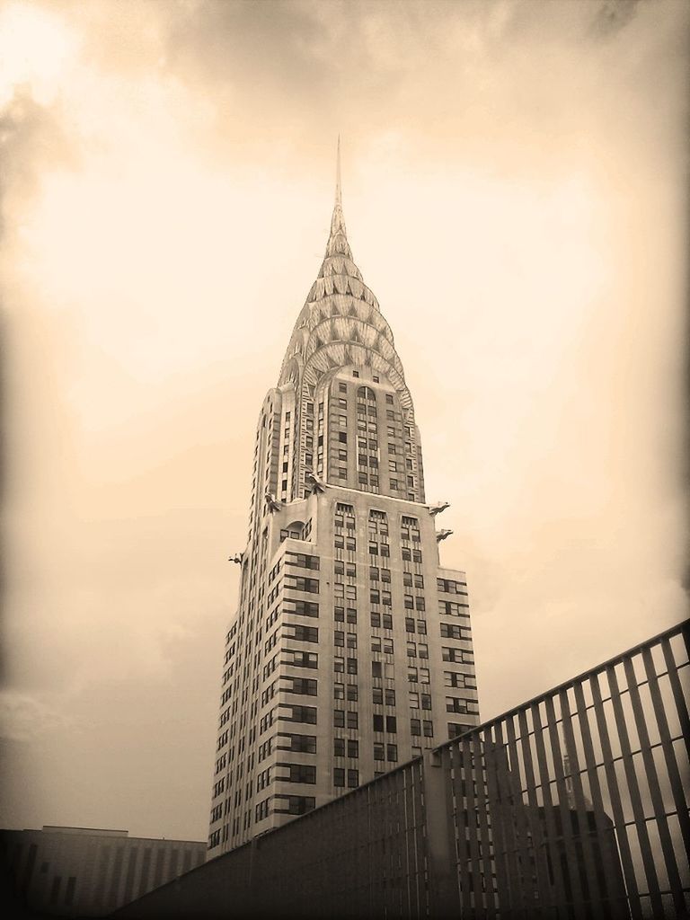 architecture, built structure, building exterior, sky, low angle view, tall - high, tower, cloud - sky, famous place, travel destinations, international landmark, city, tourism, outdoors, no people, architectural feature, travel, capital cities, day, cloudy