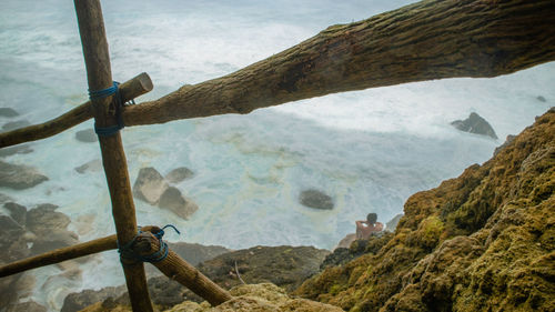 High angle view of land and sea against sky