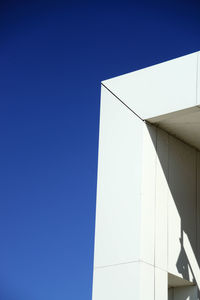 Low angle view of building against clear blue sky