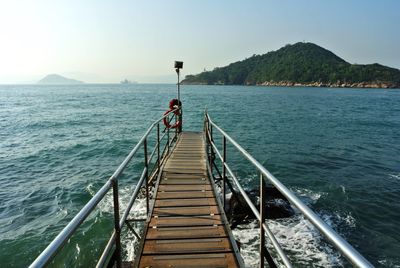 Pier over sea against sky