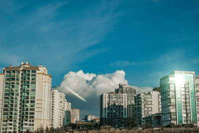 Low angle view of buildings against blue sky in ankara