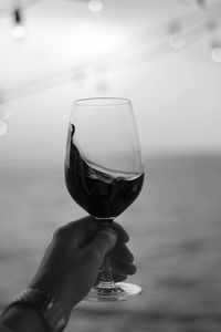 Cropped image of hand holding wineglass