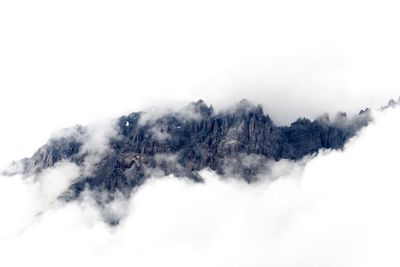Scenic view of mountains covered with clouds