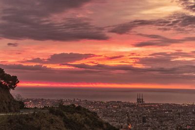 High angle view of city at sunset