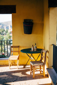 Empty chairs and tables in building