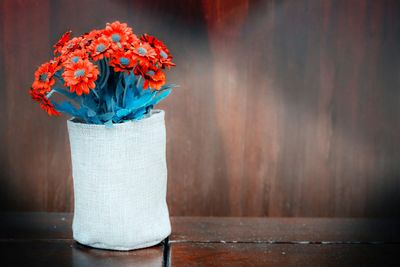 Close-up of artificial flowers in vase