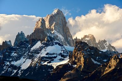 Panoramic view of snowcapped mountains against sky