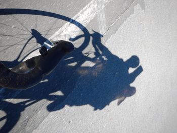 High angle view of man shadow on floor