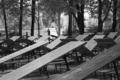 Empty chairs and table in park