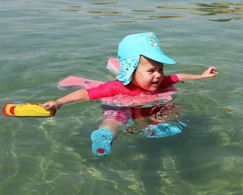 Boy swimming in sea