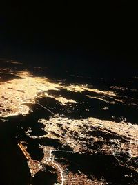 Aerial view of sea against sky at night