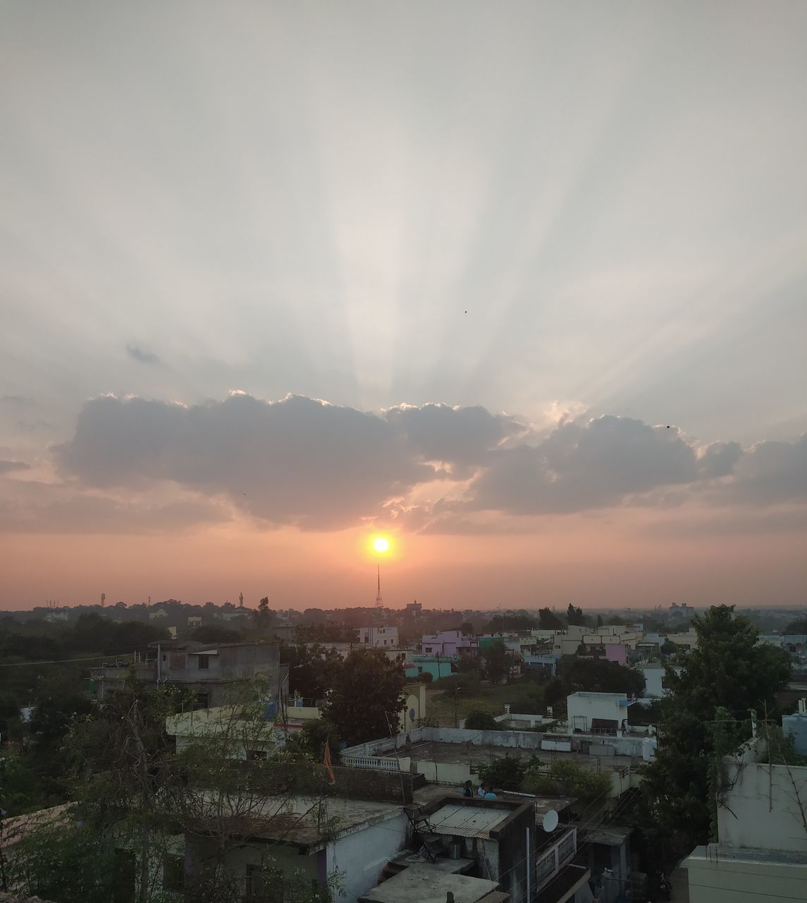 HIGH ANGLE SHOT OF TOWNSCAPE AGAINST SKY DURING SUNSET