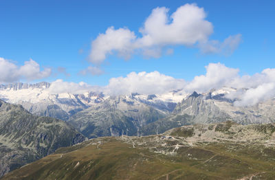 Panoramic view of snowcapped mountains against sky