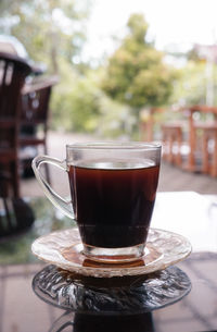 Close-up of coffee cup on table
