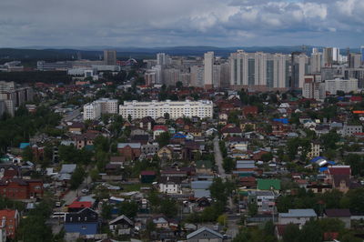 High angle view of buildings in city against sky