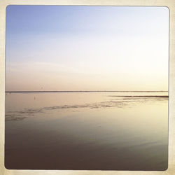 Scenic view of beach against clear sky