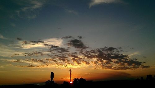 Silhouette of trees against sky during sunset