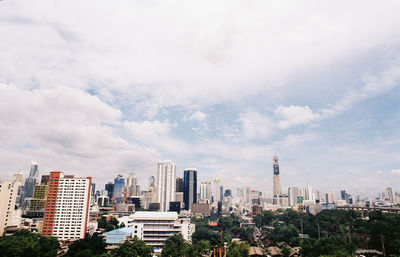 Modern buildings in city against sky