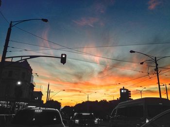 Cars on road at sunset