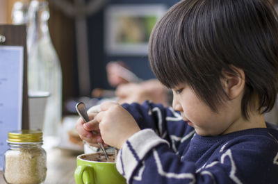 Portrait of boy holding ice cream