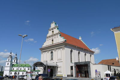 Low angle view of church against blue sky