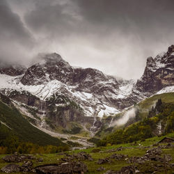 Scenic view of snowcapped mountains against sky