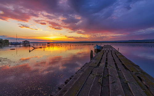 Scenic view of beach against sky during sunset