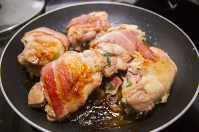 Close-up of meat in frying pan