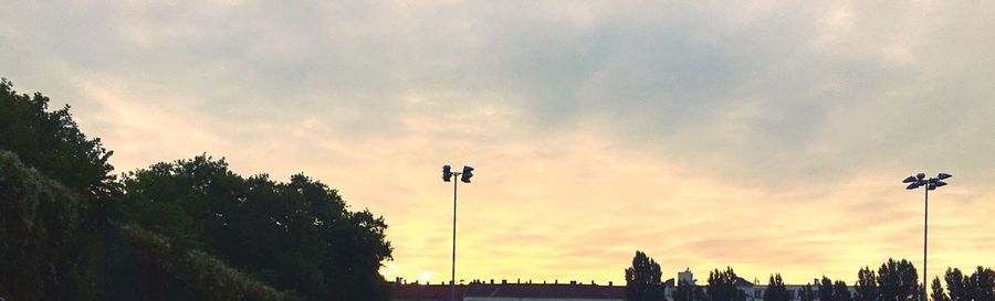Low angle view of building against cloudy sky