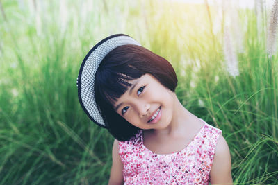 Portrait of a smiling girl on field