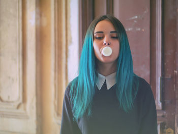 Hipster blowing bubble gum