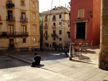 High angle view of woman standing in city