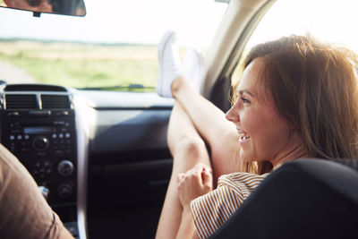 Midsection of woman in car