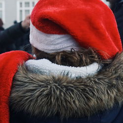 Rear view of woman in warm clothing standing outdoors