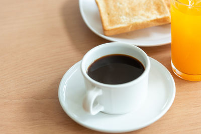 High angle view of coffee served on table