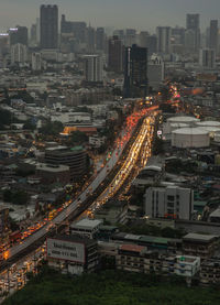 High angle view of illuminated buildings in city against sky