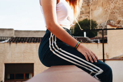 Low section of woman standing outdoors